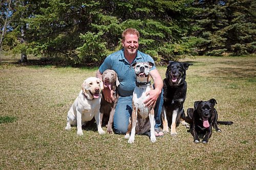 MIKE DEAL / WINNIPEG FREE PRESS
Yury Harczan a professional dog trainer who trained Anita Hart's service dog. Yury lives on six acres and has his own pack of dogs.
From left; Ecko, Grizz, Chewy, Chops, and Tux.
See Sabrina Carnevale story
210513 - Thursday, May 13, 2021.
