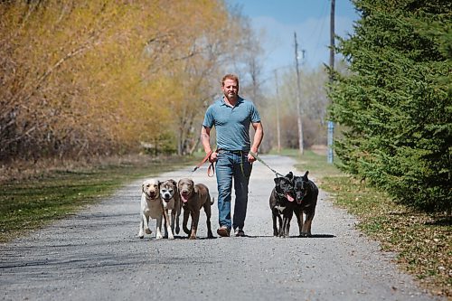 MIKE DEAL / WINNIPEG FREE PRESS
Yury Harczan a professional dog trainer who trained Anita Hart's service dog. Yury lives on six acres and has his own pack of dogs.
From left; Ecko, Chewy, Grizz, Tux, and Chops.
See Sabrina Carnevale story
210513 - Thursday, May 13, 2021.