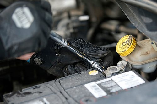 JOHN WOODS / WINNIPEG FREE PRESS
Keith Vandersluis, who took up car mechanics in the middle of the COVID-19 pandemic, works on his Dodge Grand Caravan outside his home in Winnipeg Thursday, March 13, 2021. 

Reporter: ?