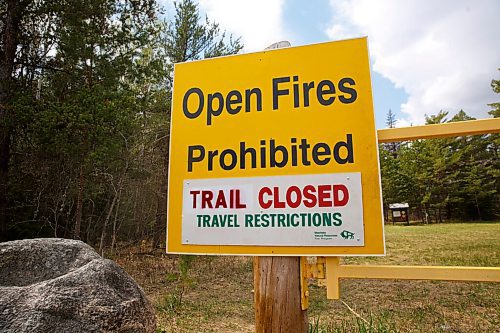 MIKE DEAL / WINNIPEG FREE PRESS
The entrance to the Hazelnut trial off of Hwy 206 into Birds Hill Provincial Park with a large "Open Fires Prohibited" sign Friday afternoon. 
The most recent restrictions announced by the province on May 13th include prohibitions on campfires and that camping is only allowed in developed campgrounds, so, no backcountry or wild camping.
210514 - Friday, May 14, 2021.