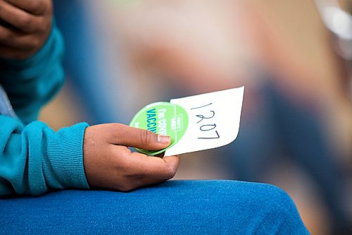 MIKAELA MACKENZIE / WINNIPEG FREE PRESS

Merhawit Teklebihan waits for her 15 minute observation period to be over after getting her COVID-19 vaccine at a pop-up community vaccine clinic at Knox United Church in Winnipeg on Friday, May 14, 2021. For JS story.
Winnipeg Free Press 2020.