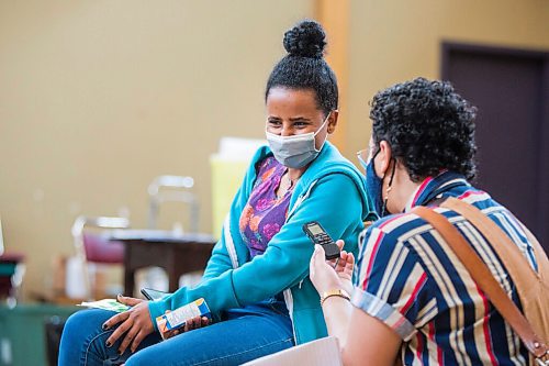 MIKAELA MACKENZIE / WINNIPEG FREE PRESS

Merhawit Teklebihan speaks to the Free Press after getting her COVID-19 vaccine at a pop-up community vaccine clinic at Knox United Church in Winnipeg on Friday, May 14, 2021. For JS story.
Winnipeg Free Press 2020.