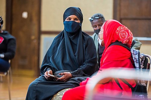 MIKAELA MACKENZIE / WINNIPEG FREE PRESS

Kuresha Mohamed and her daughter wait for the 15 minute observation period to end after getting her COVID-19 vaccine at a pop-up community vaccine clinic at Knox United Church in Winnipeg on Friday, May 14, 2021. For JS story.
Winnipeg Free Press 2020.