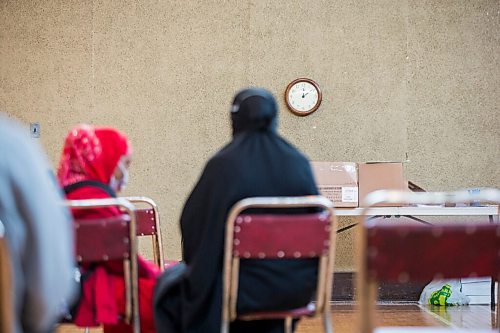 MIKAELA MACKENZIE / WINNIPEG FREE PRESS

Kuresha Mohamed and her daughter wait for the 15 minute observation period to end after getting her COVID-19 vaccine at a pop-up community vaccine clinic at Knox United Church in Winnipeg on Friday, May 14, 2021. For JS story.
Winnipeg Free Press 2020.