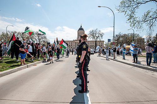 MIKE SUDOMA / WINNIPEG FREE PRESS  
A wall of WPS officers keep the Israeli and Palestinian protesters apart after tensions rose during a rally at memorial park in downtown Winnipeg Saturday afternoon due to the rising tensions over seas
May 15, 2021