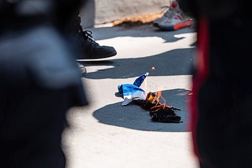 MIKE SUDOMA / WINNIPEG FREE PRESS  
Palestinian protesters stand around the remains of a burning Israeli flag that was stolen by a Palestinian protester during a rally in Memorial Park in downtown Winnipeg Saturday afternoon due to the rising tensions over seas
May 15, 2021