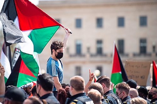 MIKE SUDOMA / WINNIPEG FREE PRESS  
Palestinian protesters wave flags and yell chants against the opposing Israeli rally Saturday afternoon
May 15, 2021