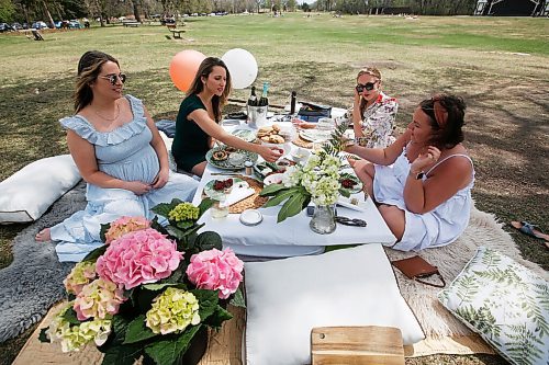 JOHN WOODS / WINNIPEG FREE PRESS
Friends Liz Cleven, from left, Lindsay Moore, Uta Krueger and Alison Beyer relax at a surprise baby shower for Cleven at Assiniboine Park in Winnipeg Sunday, May 16, 2021. People having been heading to the parks because of increased COVID-19 restrictions.

Reporter: Abas & Da Silva