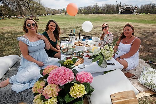 JOHN WOODS / WINNIPEG FREE PRESS
Friends Liz Cleven, from left, Lindsay Moore, Uta Krueger and Alison Beyer relax at a surprise baby shower for Cleven at Assiniboine Park in Winnipeg Sunday, May 16, 2021. People having been heading to the parks because of increased COVID-19 restrictions.

Reporter: Abas & Da Silva