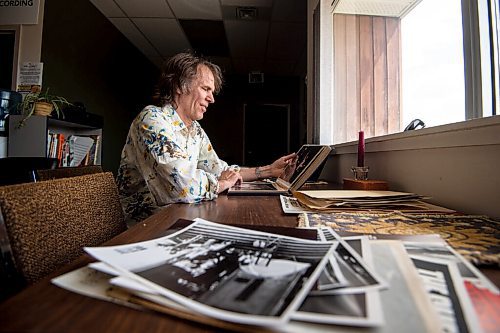 MIKE SUDOMA / WINNIPEG FREE PRESS
Local musician/producer, Lloyd Peterson, smiles while looking through a book of old photos from when he was recording with his band The Cheer Monday afternoon inside Paintbox Recording
May 17, 2021