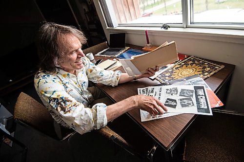 MIKE SUDOMA / WINNIPEG FREE PRESS
Local musician/producer, Lloyd Peterson, smiles while looking through a pile off show posters from when he was performing with his band The Cheer Monday afternoon inside Paintbox Recording
May 17, 2021