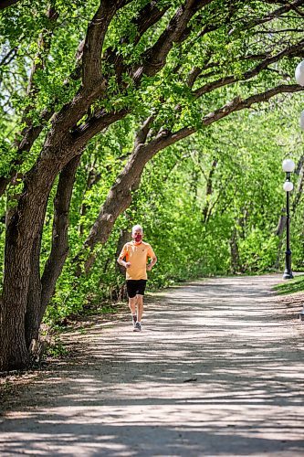 MIKAELA MACKENZIE / WINNIPEG FREE PRESS

John Preston runs under the newly leafed out tree canopy at The Forks in Winnipeg on Tuesday, May 18, 2021. Standup.
Winnipeg Free Press 2020.