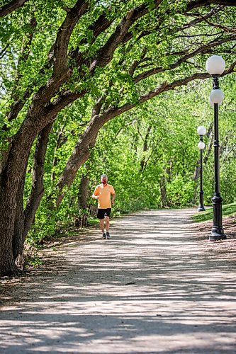 MIKAELA MACKENZIE / WINNIPEG FREE PRESS

John Preston runs under the newly leafed out tree canopy at The Forks in Winnipeg on Tuesday, May 18, 2021. Standup.
Winnipeg Free Press 2020.