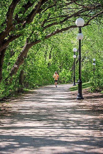 MIKAELA MACKENZIE / WINNIPEG FREE PRESS

John Preston runs under the newly leafed out tree canopy at The Forks in Winnipeg on Tuesday, May 18, 2021. Standup.
Winnipeg Free Press 2020.