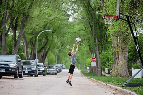 MIKAELA MACKENZIE / WINNIPEG FREE PRESS

Marko Shevchenko, nine, shoots some hoops alone during his recess break while distance learning at home in Wolseley in Winnipeg on Wednesday, May 19, 2021.  Standup.
Winnipeg Free Press 2020.