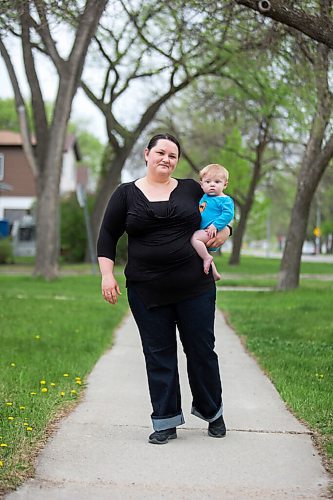 MIKAELA MACKENZIE / WINNIPEG FREE PRESS

Megan Collison poses for a portrait with her baby, Calvin, at her home in Winnipeg on Wednesday, May 19, 2021.  Megan Collison lost her mother to COVID at the start of the pandemic, right before she had a chance to tell her she was a grandma. For Jen Zoratti story.
Winnipeg Free Press 2020.