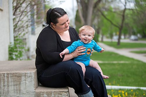 MIKAELA MACKENZIE / WINNIPEG FREE PRESS

Megan Collison poses for a portrait with her baby, Calvin, at her home in Winnipeg on Wednesday, May 19, 2021.  Megan Collison lost her mother to COVID at the start of the pandemic, right before she had a chance to tell her she was a grandma. For Jen Zoratti story.
Winnipeg Free Press 2020.