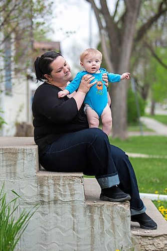 MIKAELA MACKENZIE / WINNIPEG FREE PRESS

Megan Collison poses for a portrait with her baby, Calvin, at her home in Winnipeg on Wednesday, May 19, 2021.  Megan Collison lost her mother to COVID at the start of the pandemic, right before she had a chance to tell her she was a grandma. For Jen Zoratti story.
Winnipeg Free Press 2020.