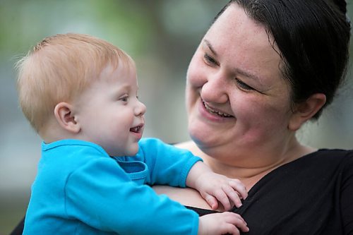 MIKAELA MACKENZIE / WINNIPEG FREE PRESS

Megan Collison poses for a portrait with her baby, Calvin, at her home in Winnipeg on Wednesday, May 19, 2021.  Megan Collison lost her mother to COVID at the start of the pandemic, right before she had a chance to tell her she was a grandma. For Jen Zoratti story.
Winnipeg Free Press 2020.