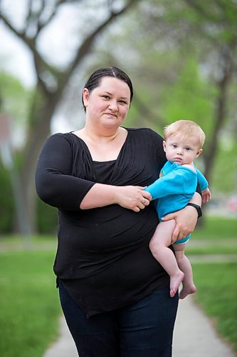 MIKAELA MACKENZIE / WINNIPEG FREE PRESS

Megan Collison poses for a portrait with her baby, Calvin, at her home in Winnipeg on Wednesday, May 19, 2021.  Megan Collison lost her mother to COVID at the start of the pandemic, right before she had a chance to tell her she was a grandma. For Jen Zoratti story.
Winnipeg Free Press 2020.