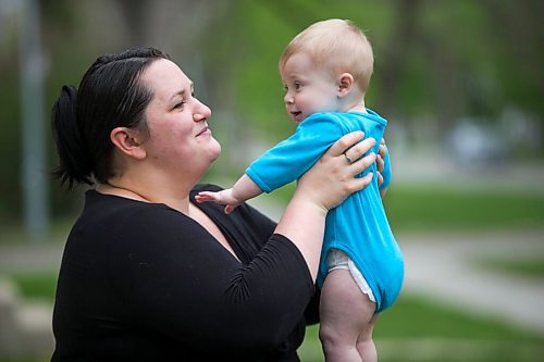 MIKAELA MACKENZIE / WINNIPEG FREE PRESS

Megan Collison poses for a portrait with her baby, Calvin, at her home in Winnipeg on Wednesday, May 19, 2021.  Megan Collison lost her mother to COVID at the start of the pandemic, right before she had a chance to tell her she was a grandma. For Jen Zoratti story.
Winnipeg Free Press 2020.