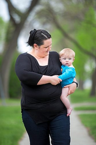 MIKAELA MACKENZIE / WINNIPEG FREE PRESS

Megan Collison poses for a portrait with her baby, Calvin, at her home in Winnipeg on Wednesday, May 19, 2021.  Megan Collison lost her mother to COVID at the start of the pandemic, right before she had a chance to tell her she was a grandma. For Jen Zoratti story.
Winnipeg Free Press 2020.