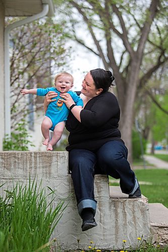 MIKAELA MACKENZIE / WINNIPEG FREE PRESS

Megan Collison poses for a portrait with her baby, Calvin, at her home in Winnipeg on Wednesday, May 19, 2021.  Megan Collison lost her mother to COVID at the start of the pandemic, right before she had a chance to tell her she was a grandma. For Jen Zoratti story.
Winnipeg Free Press 2020.