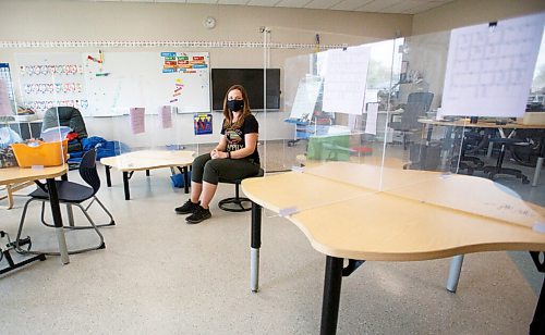 MIKE DEAL / WINNIPEG FREE PRESS
Teacher Jessica Grant sits surrounded by the plexiglass partitioned desks of her grade 1-3 students in her classroom at R. F. Morrison School. 
See Maggie Macintosh story
210519 - Wednesday, May 19, 2021.