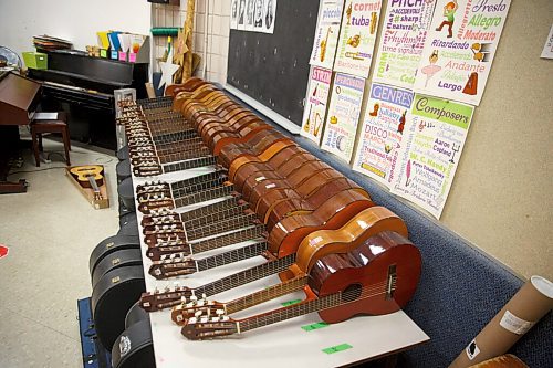 MIKE DEAL / WINNIPEG FREE PRESS
Guitars are lined up on a table in the music room at R. F. Morrison School.
See Maggie Macintosh story
210519 - Wednesday, May 19, 2021.