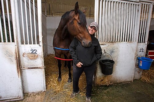 MIKE DEAL / WINNIPEG FREE PRESS
Trainer Shelley Brown with Real Grace, winner of the 2020 Canadian Derby, in her barn at Assiniboia Downs Thursday morning.
See George Williams story
210520 - Thursday, May 20, 2021.