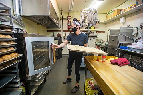 MIKAELA MACKENZIE / WINNIPEG FREE PRESS

Carter Bouchard, owner of Salt and Sunshine Bagels (a specialty bagel bakery she started on Instagram during the pandemic), whips up a batch of sesame bagels in her rented kitchen space at the Irish Association in Winnipeg on Thursday, May 20, 2021.  For Eva Wasney story.
Winnipeg Free Press 2020.