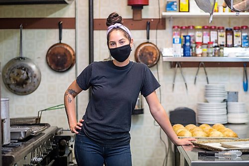 MIKAELA MACKENZIE / WINNIPEG FREE PRESS

Carter Bouchard, owner of Salt and Sunshine Bagels (a specialty bagel bakery she started on Instagram during the pandemic), poses for a portrait in her rented kitchen space at the Irish Association in Winnipeg on Thursday, May 20, 2021.  For Eva Wasney story.
Winnipeg Free Press 2020.