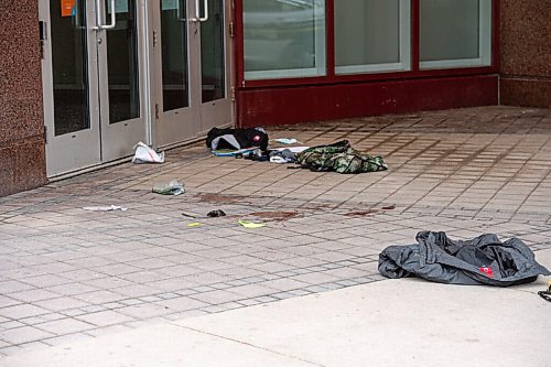 MIKE SUDOMA / WINNIPEG FREE PRESS  
Piles of clothes and blood line the entrance to the Portage Place Foodcourt Friday morning
May 21, 2021