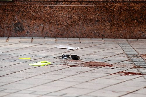 MIKE SUDOMA / WINNIPEG FREE PRESS  
A pair of sun glasses lie in a pool of blood at the entrance to the Portage Place Foodcourt Friday morning
May 21, 2021