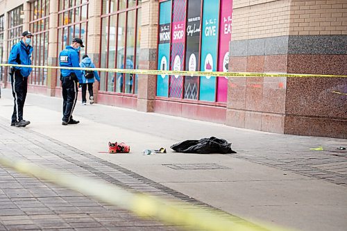 MIKE SUDOMA / WINNIPEG FREE PRESS  
Winnipeg Police Cadets block off a scene in front of the Portage Place Foodcourt Friday
May 21, 2021