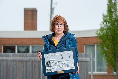 MIKE SUDOMA / WINNIPEG FREE PRESS  
Pam Lucenkiw, holds up a plaque St Marys Road United Church received from the Manitoba Chimney Swift Initiative, for their work with monitoring the chimney swifts in the churchs chimney.
May 21, 2021