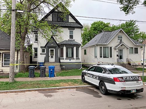 Winnipeg police at the scene of a homicide in the 300 block of Burrows Avenue on the morning of May 21, 2021. The body of Trevor Clayton Dorion, 33, was found the previous afternoon. (Adam Treusch / Winnipeg Free Press)
