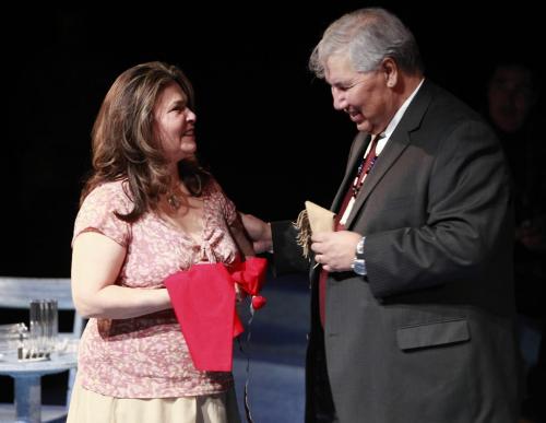 BORIS.MINKEVICH@FREEPRESS.MB.CA WINNIPEG FREE PRESS 100311 Truth and Reconciliation Commission Chair Justice Murray Sinclair hands a red scarf to actress Margo Kane after he gives blessing to Kevin Loring's play Where the Blood Mixes at The Prairie Theatre Exchange.