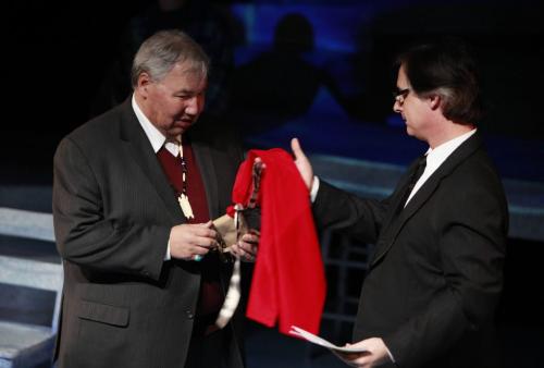BORIS.MINKEVICH@FREEPRESS.MB.CA  WINNIPEG FREE PRESS 100311 PTE Artistic director Robert Metcalfe, right, hands a pouch of tobacco and a red scarf to Truth and Reconciliation Commission Chair Justice Murray Sinclair before he gives blessing to Kevin Loring's play Where the Blood Mixes at The Prairie Theatre Exchange.