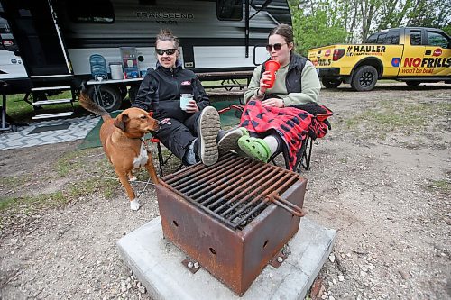 JOHN WOODS / WINNIPEG FREE PRESS
Cheryl Hoium, left, and her daughter Chanel Hoium with their dog Alli relax during their camping long weekend at Birds Hill Park just outside of Winnipeg Sunday, May 23, 2021. 

Reporter: JS