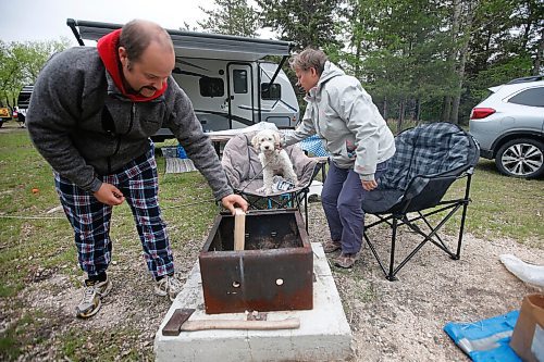 JOHN WOODS / WINNIPEG FREE PRESS
Josh and mother Emily Etcheverry and their dog Buster relax during their camping long weekend at Birds Hill Park just outside of Winnipeg Sunday, May 23, 2021. 

Reporter: JS