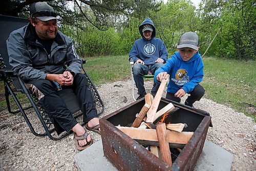 JOHN WOODS / WINNIPEG FREE PRESS
Allen Cummer and his sons Dawson, left, and Bently relax during their camping long weekend at Birds Hill Park just outside of Winnipeg Sunday, May 23, 2021. 

Reporter: JS