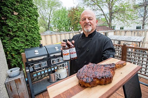 MIKAELA MACKENZIE / WINNIPEG FREE PRESS

Steve Hunt-Lesage, owner Fat Iguana Chef's Kitchen, poses for a portrait with a steak and a couple of his sauces in Winnipeg on Tuesday, May 25, 2021. For Dave Sanderson story.
Winnipeg Free Press 2020.