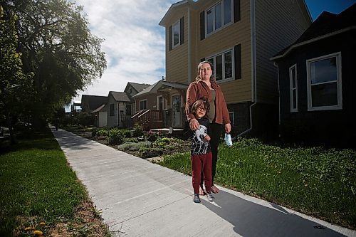 JOHN WOODS / WINNIPEG FREE PRESS
Aleecia Doyle, who has had a cancerous tumour on her lung since March, is photographed with her son Liam on her street in Winnipeg Wednesday, May 26, 2021. An overburdened healthcare system means Doyle and others in need of surgery can not be treated. 

Reporter: Robertson