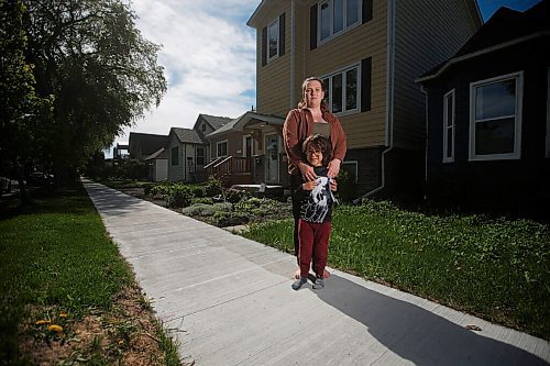 JOHN WOODS / WINNIPEG FREE PRESS
Aleecia Doyle, who has had a cancerous tumour on her lung since March, is photographed with her son Liam on her street in Winnipeg Wednesday, May 26, 2021. An overburdened healthcare system means Doyle and others in need of surgery can not be treated. 

Reporter: Robertson