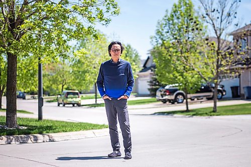 MIKAELA MACKENZIE / WINNIPEG FREE PRESS

Dr. Anthony Battad, who is speaking out about the inequality of the pandemic, poses for a portrait in front of his home in Winnipeg on Friday, May 28, 2021. Battad is a Filipino internal medicine physician who has been working in COVID wards off and on during the pandemic, and he's also involved in outreach efforts through the Chamber of Commerce to engage the Filipino and South Asian communities (on vaccines and public-health messages). He says most of the people he sees admitted to hospital now are lower income folks who have not been able to work from home. For Katie May story.
Winnipeg Free Press 2020.