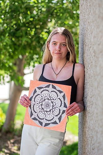MIKAELA MACKENZIE / WINNIPEG FREE PRESS

Madi Daley, a grade 10 student at J.H. Bruns who has been using art and being outside to cope with the stresses of this chaotic school year, poses for a portrait with a piece that she created in Winnipeg on Friday, May 28, 2021. Daley said more needs to be done to talk about mental health at school. For Maggie Macintosh story.
Winnipeg Free Press 2020.