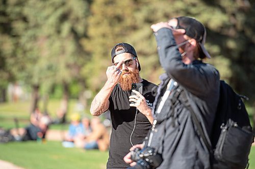 MIKE SUDOMA / WINNIPEG FREE PRESS  
A protester flips off the camera during an anti mask event at the forks Friday
May 28, 2021