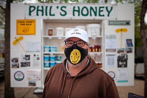 Daniel Crump / Winnipeg Free Press. Phil Veldhaus has been selling honey at St. Norbert Farmers Market for thirty plus years. The market is able to stay open at reduced capacity during the current public health orders. May 29, 2021.