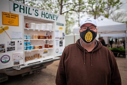 Daniel Crump / Winnipeg Free Press. Phil Veldhaus has been selling honey at St. Norbert Farmers Market for thirty plus years. The market is able to stay open at reduced capacity during the current public health orders. May 29, 2021.